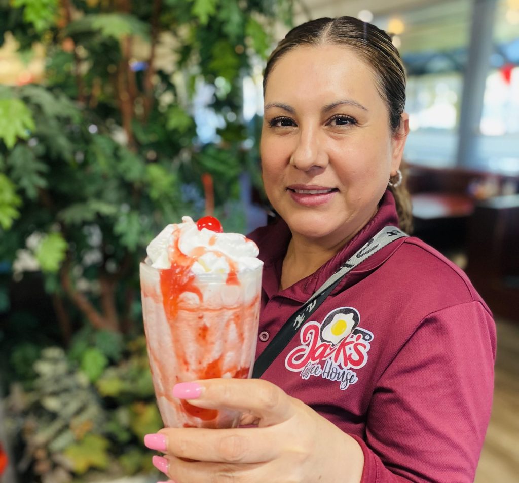 Cheers! One of the Jack's members with a Strawberry Milkshake